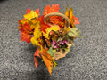 Fall foliage wicker basket with faux maple leaves and purple daisies
