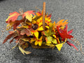 Fall wicker basket with faux sunflowers, maple leaves, and curly willow