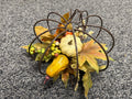 Rustic wire pumpkin frame centerpiece with faux gourds, berries, and fall maple leaves