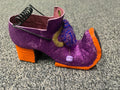 Purple glitter witch shoe Halloween decoration with orange heel and coiled wire stem