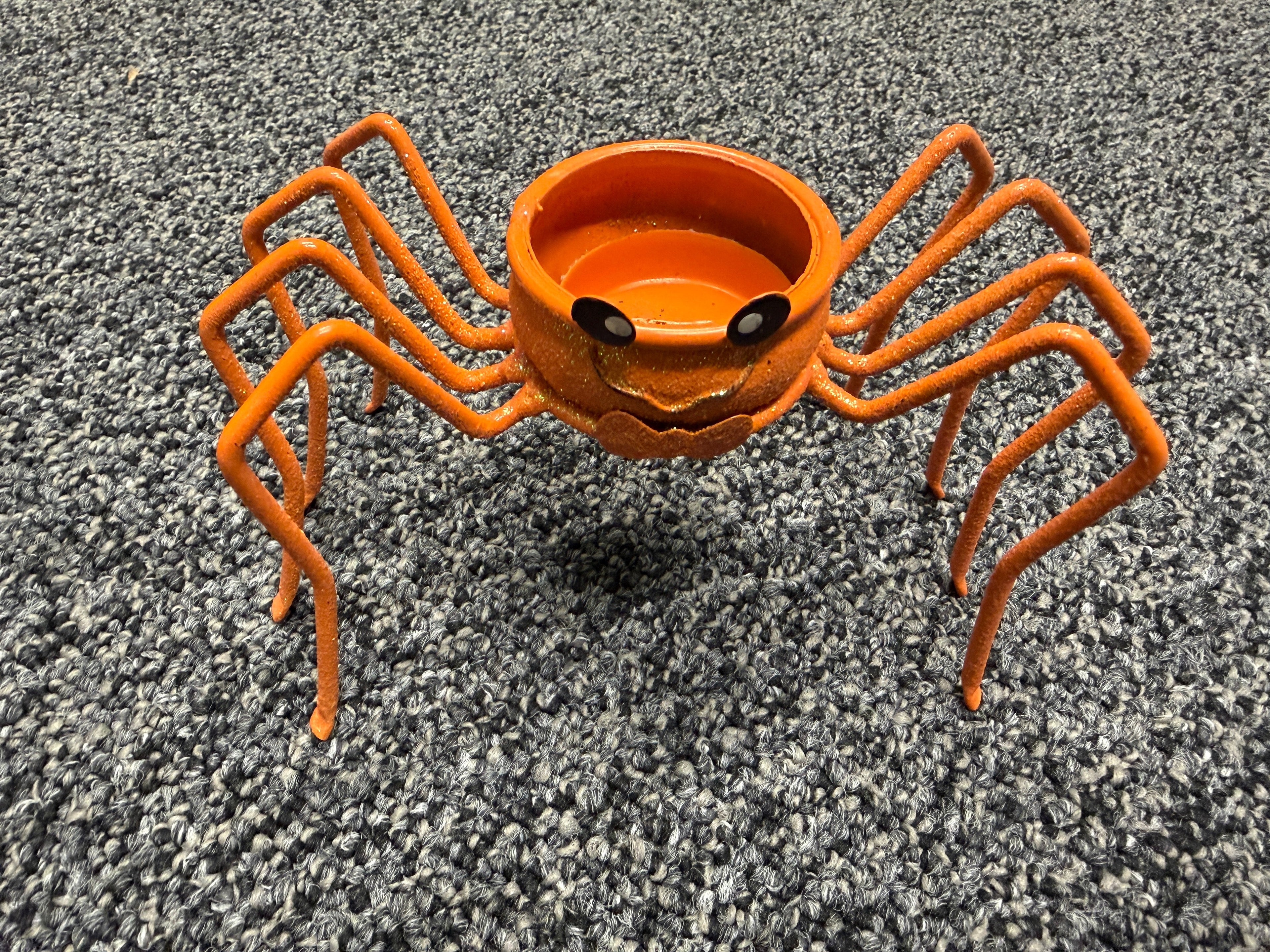 Orange glitter spider pumpkin tealight candle holder with wire legs and jack-o-lantern face