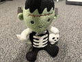 Frankenstein plush doll with skeleton outfit and skull