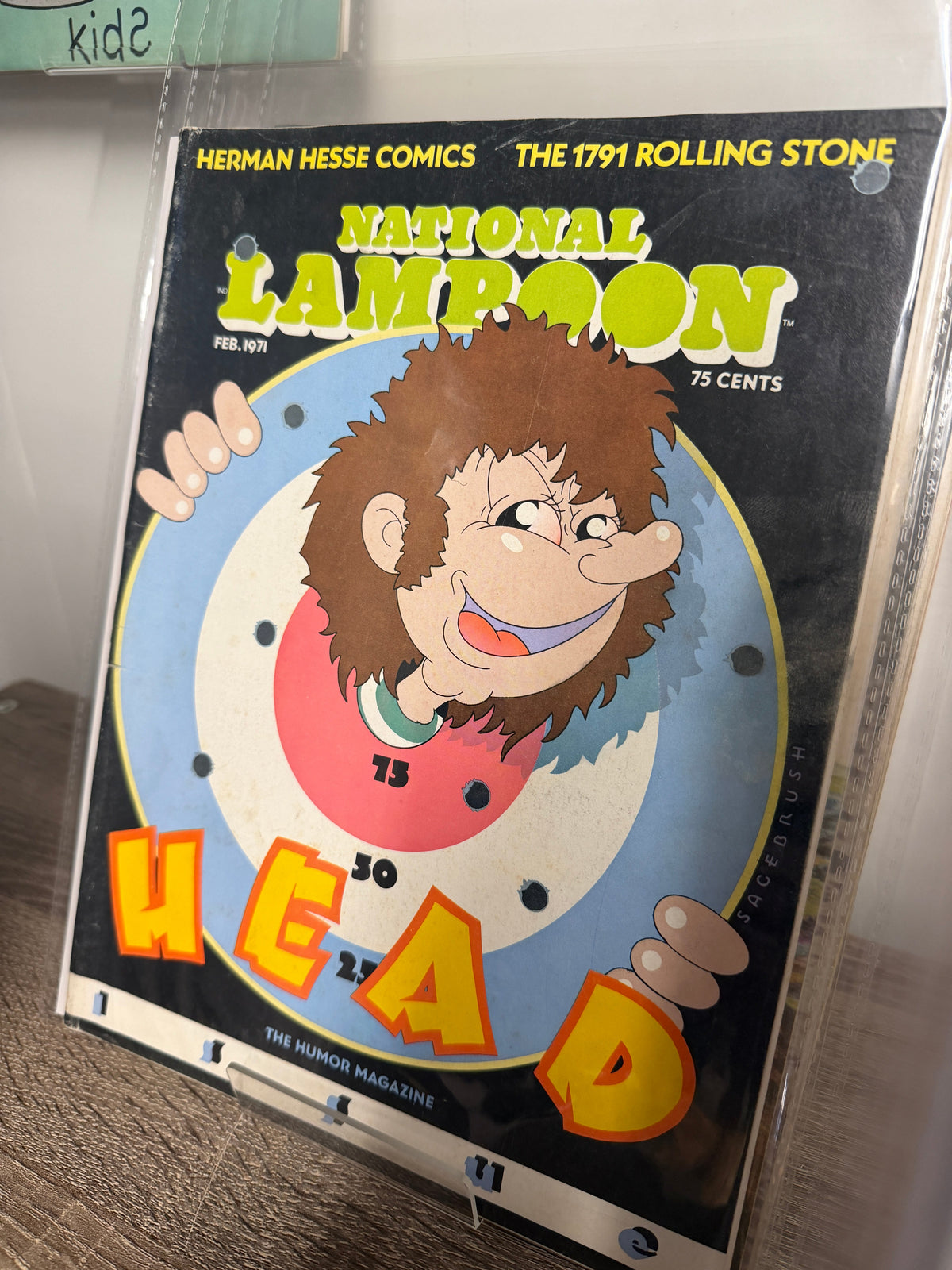 National Lampoon February 1971 Head issue, Sagebrush cartoon kid bursting through bullseye cover