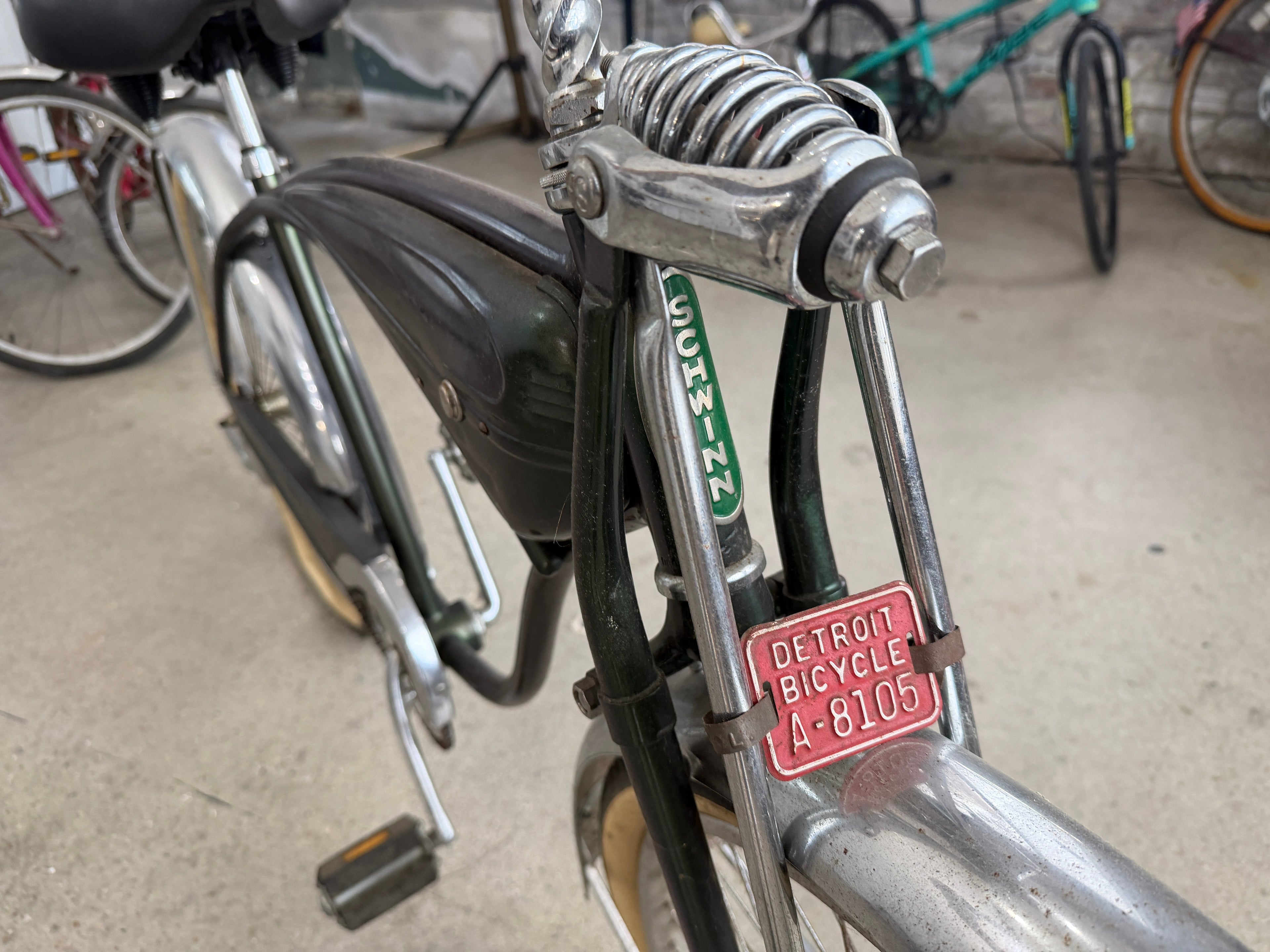 Detroit Bicycle license plate A-8105 on Schwinn springer fork, original red enamel metal plate