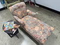 Floral upholstered chaise lounge with extended lounge seating, raised back, rolled arm, and soft vintage-inspired floral tapestry pattern in pink, peach, and sage — on consignment at The Foundry by History Loves Company in downtown Pontiac, Michigan