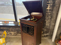 Antique Thomas A. Edison C-19 Disc Phonograph cabinet with lift-top open showing turntable, tonearm, and Edison Diamond Disc record — working antique phonograph with included records at The Foundry by History Loves Company in downtown Pontiac, Michigan