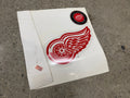Detroit Red Wings winged wheel die-cut decal on original white backing, Western Conference Central Division seal, never applied