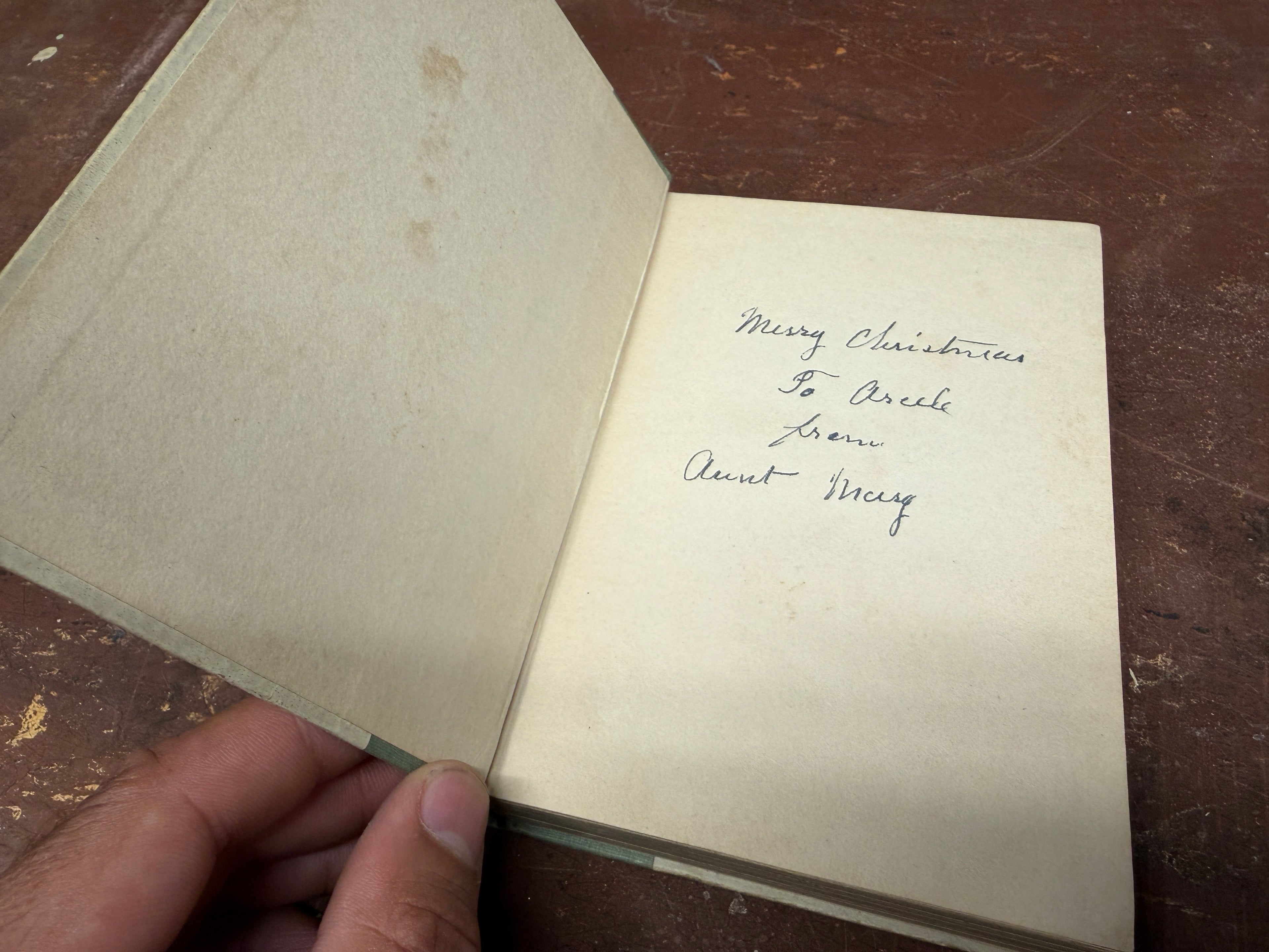 Interior inscription of Stepping Heavenward: Merry Christmas To Arcele from Aunt Merg, period cursive handwriting
