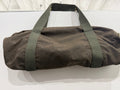 The Weekender Duffle in dark olive by The Foundry, made in Pontiac Michigan, top carry handles with brass hardware