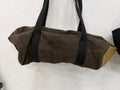 The Day Trip Duffle in olive waxed canvas with tan end panels and black straps, Pontiac Built by The Foundry