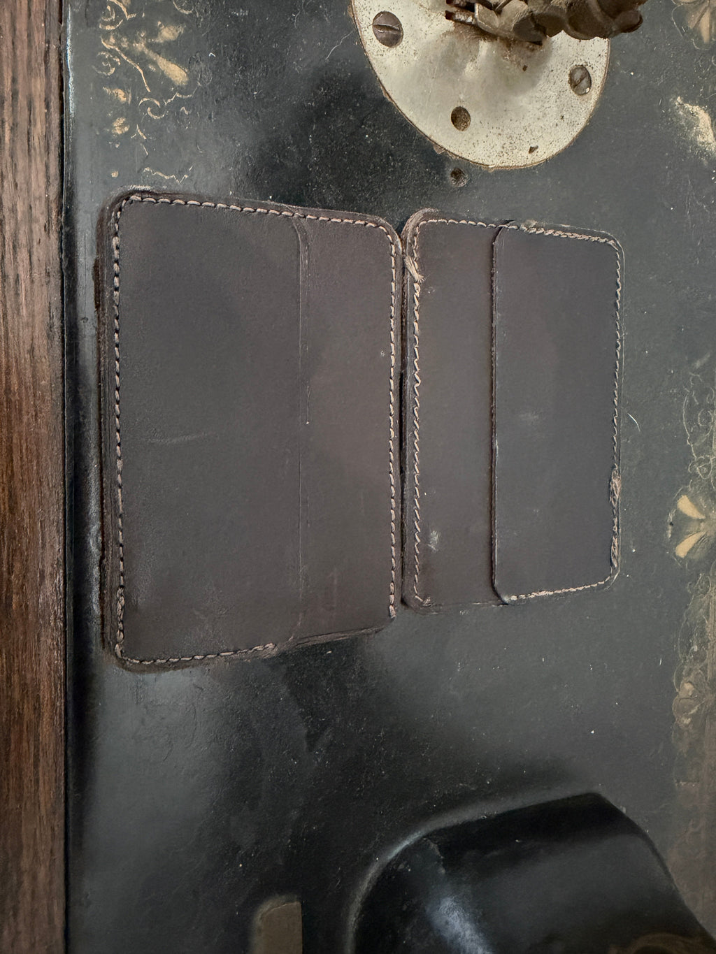 The Switch Wallet classic bifold open view — dark chocolate leather with large left pocket and two card slots right, tan saddle stitch, Pontiac Built