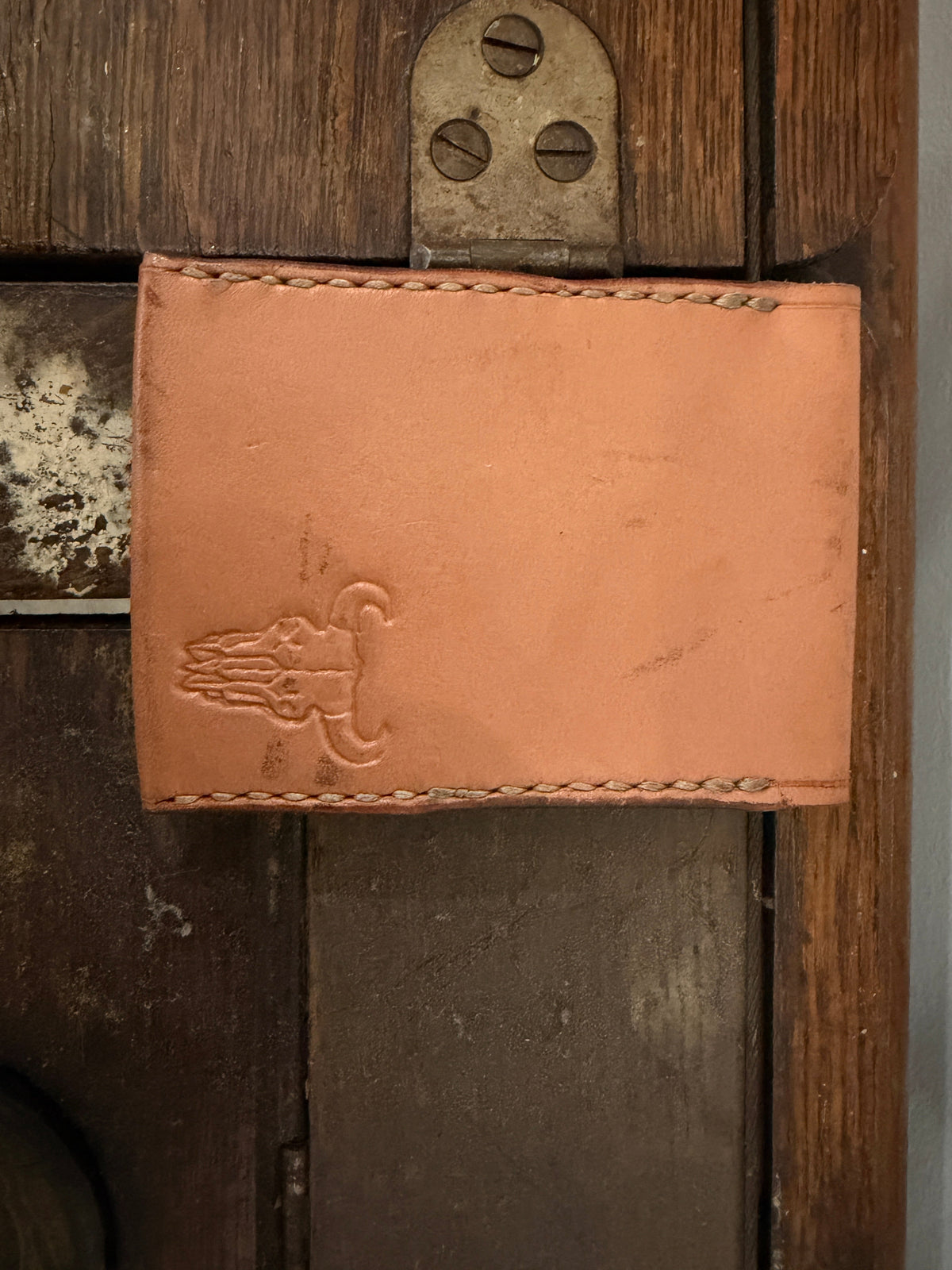 The Courier Envelope Wallet in natural tan veg-tan leather with Foundry maker mark stamp, hand-stitched, Pontiac Built