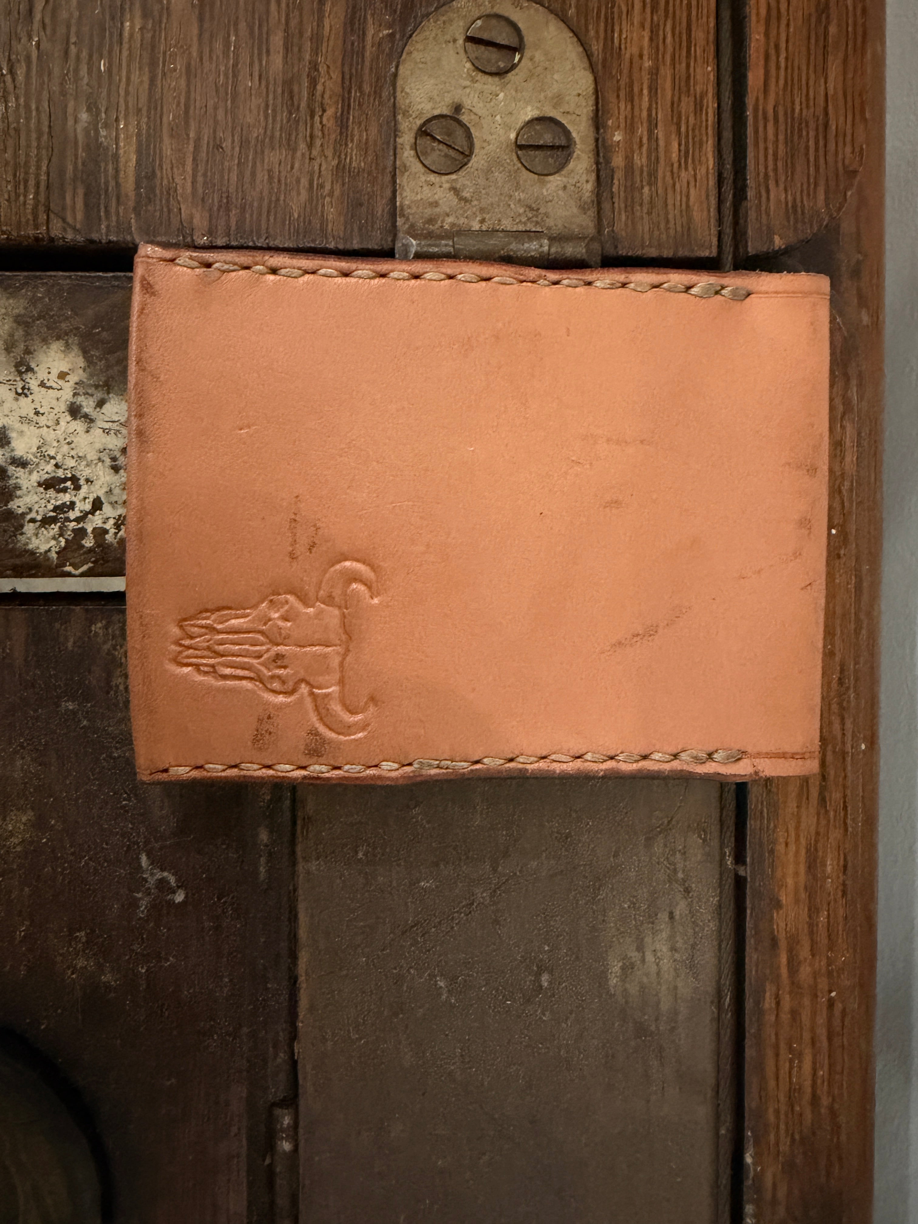 The Forge Billfold in natural tan full-grain leather with hand-stamped Foundry maker mark and cream saddle stitch, Pontiac Built