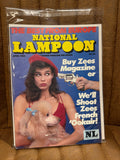 National Lampoon April 1985 The Best from Europe sealed in original poly bag, French poodle cover with Buy Zees Magazine or We'll Shoot Zees French Ookair, cover price $2.00