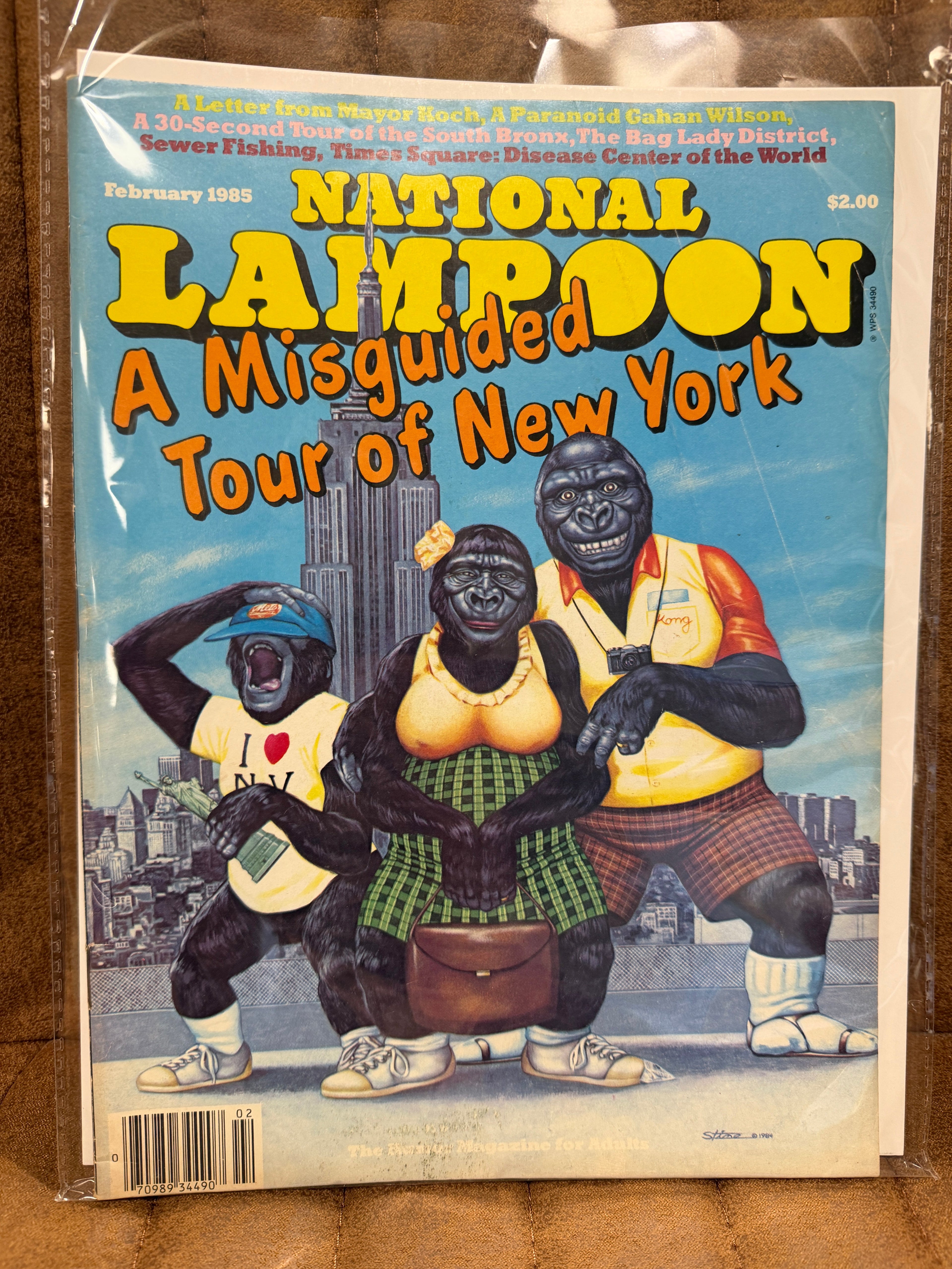 National Lampoon February 1985 A Misguided Tour of New York sealed in original poly bag, gorilla tourists cover illustration, cover price $2.00