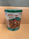 Lincoln Logs 100th Anniversary collector's tin with green lid, illustrated label showing log cabin, America's National Toy centennial edition