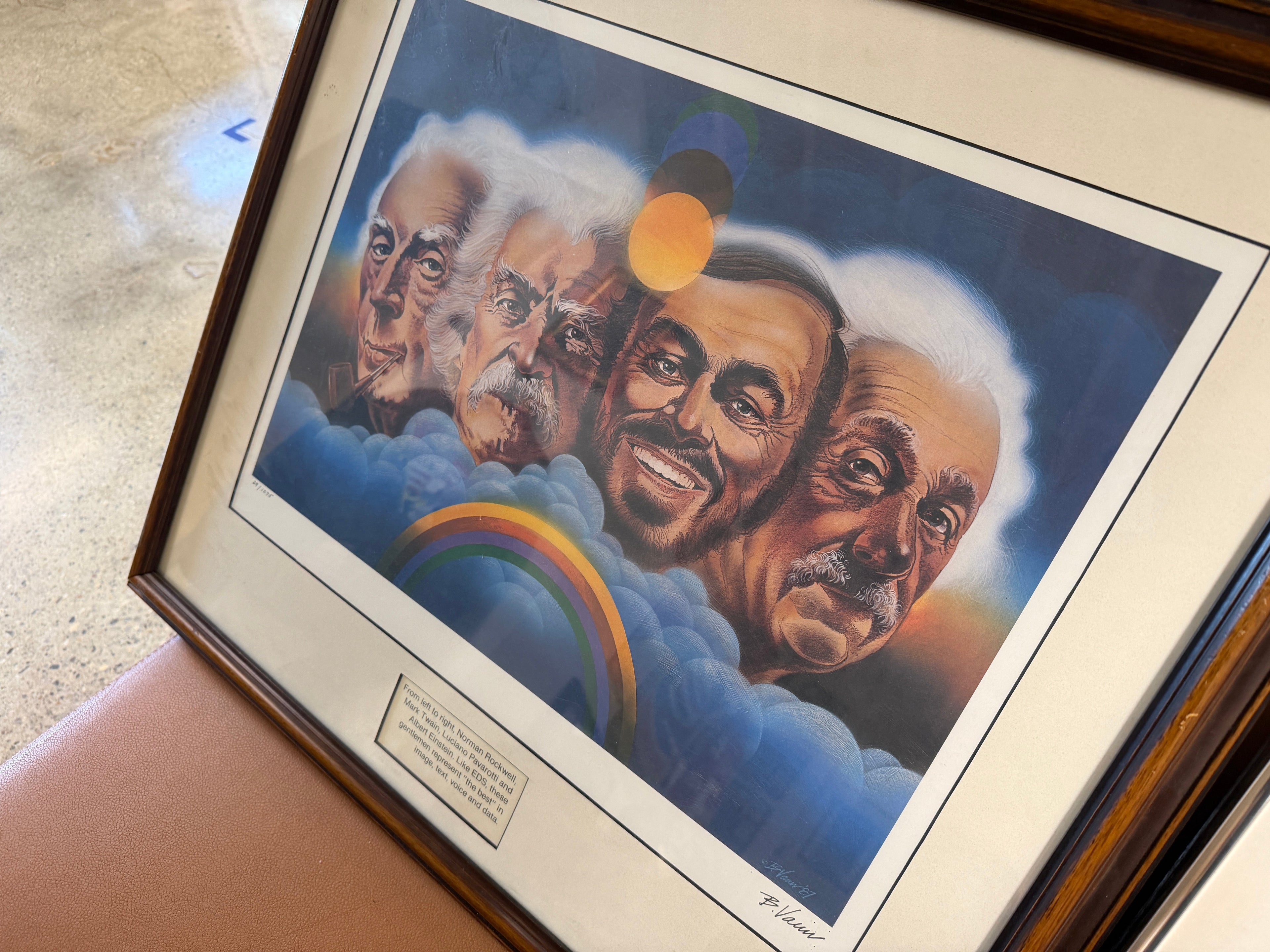 Limited edition signed print 29 of 1075 depicting Einstein, Rockwell, Twain and Pavarotti as portrait faces emerging from clouds with rainbow, framed with white mat, artist signed P. Vann