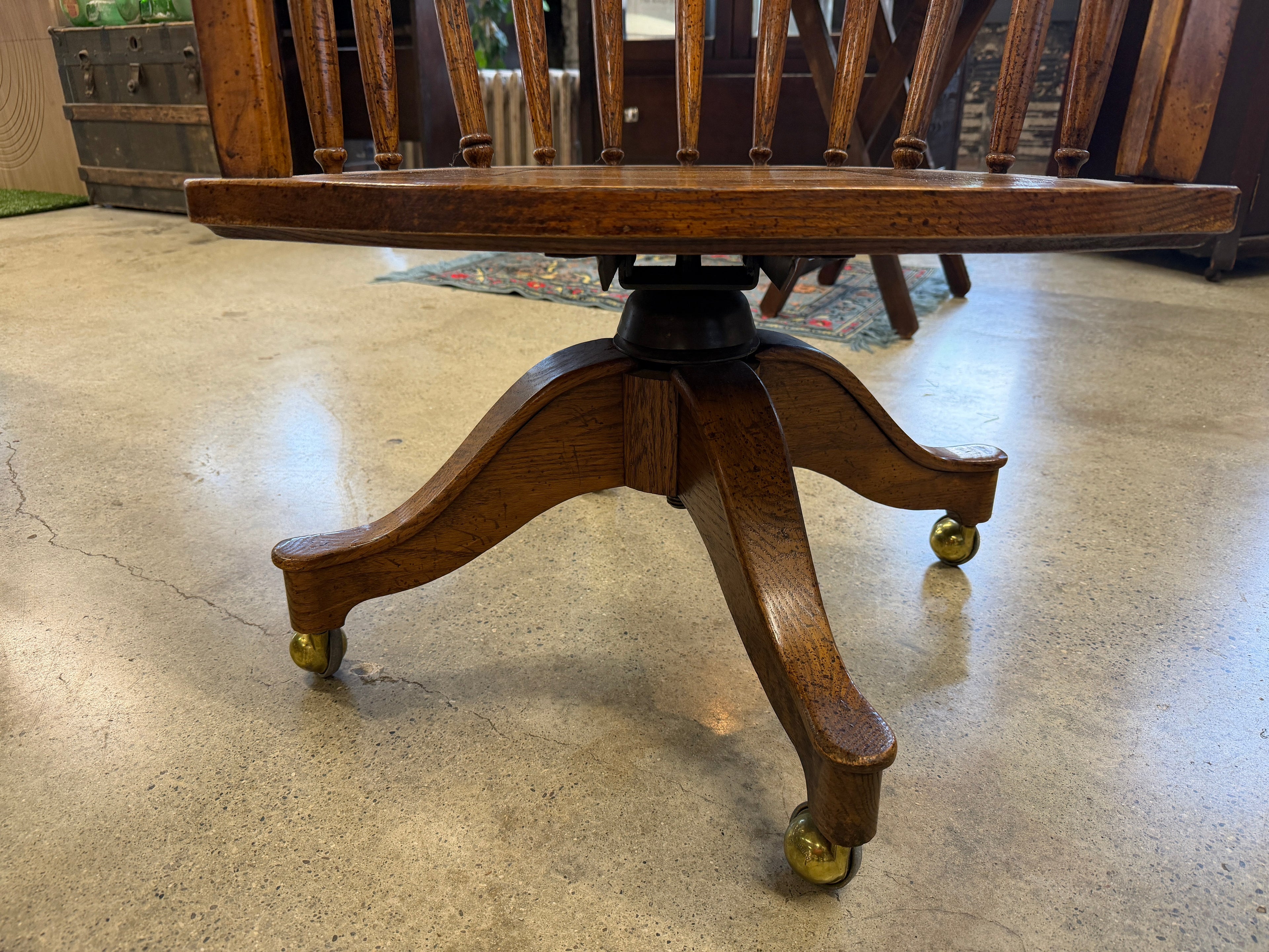 Antique oak banker swivel chair pedestal base with brass ball casters