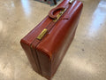 Vintage cognac brown leather attaché briefcase with brass hardware and top handle