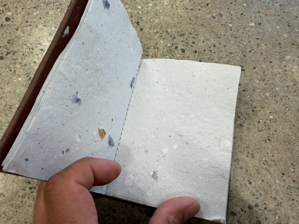 Interior blank pages of hand-tooled leather Charmander journal