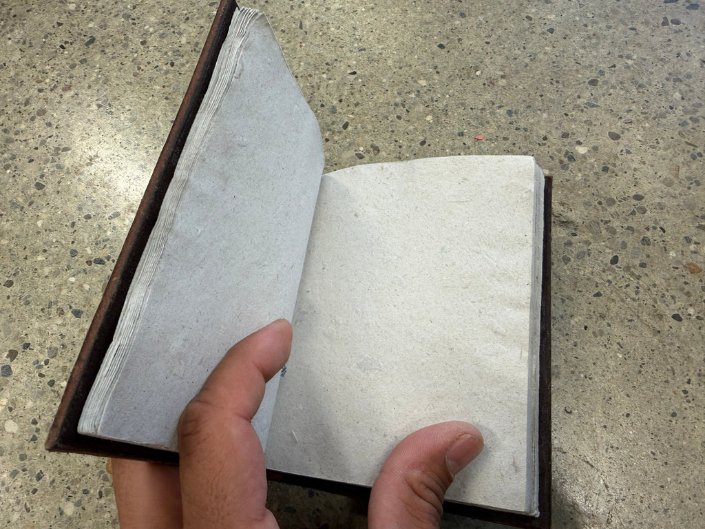 Interior blank pages of hand-tooled leather wolf journal