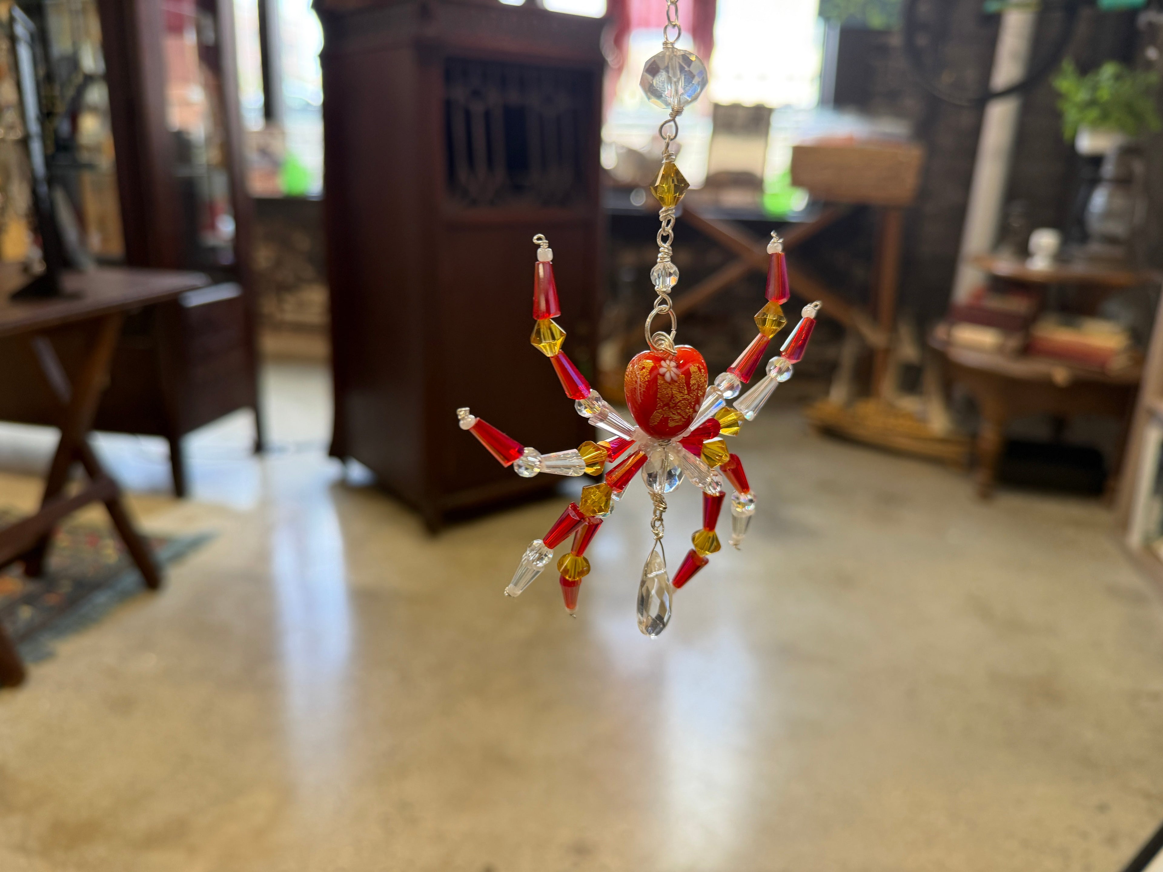 Handcrafted red and gold crystal beaded spider ornament hanging, made by Sheri Fuceneri