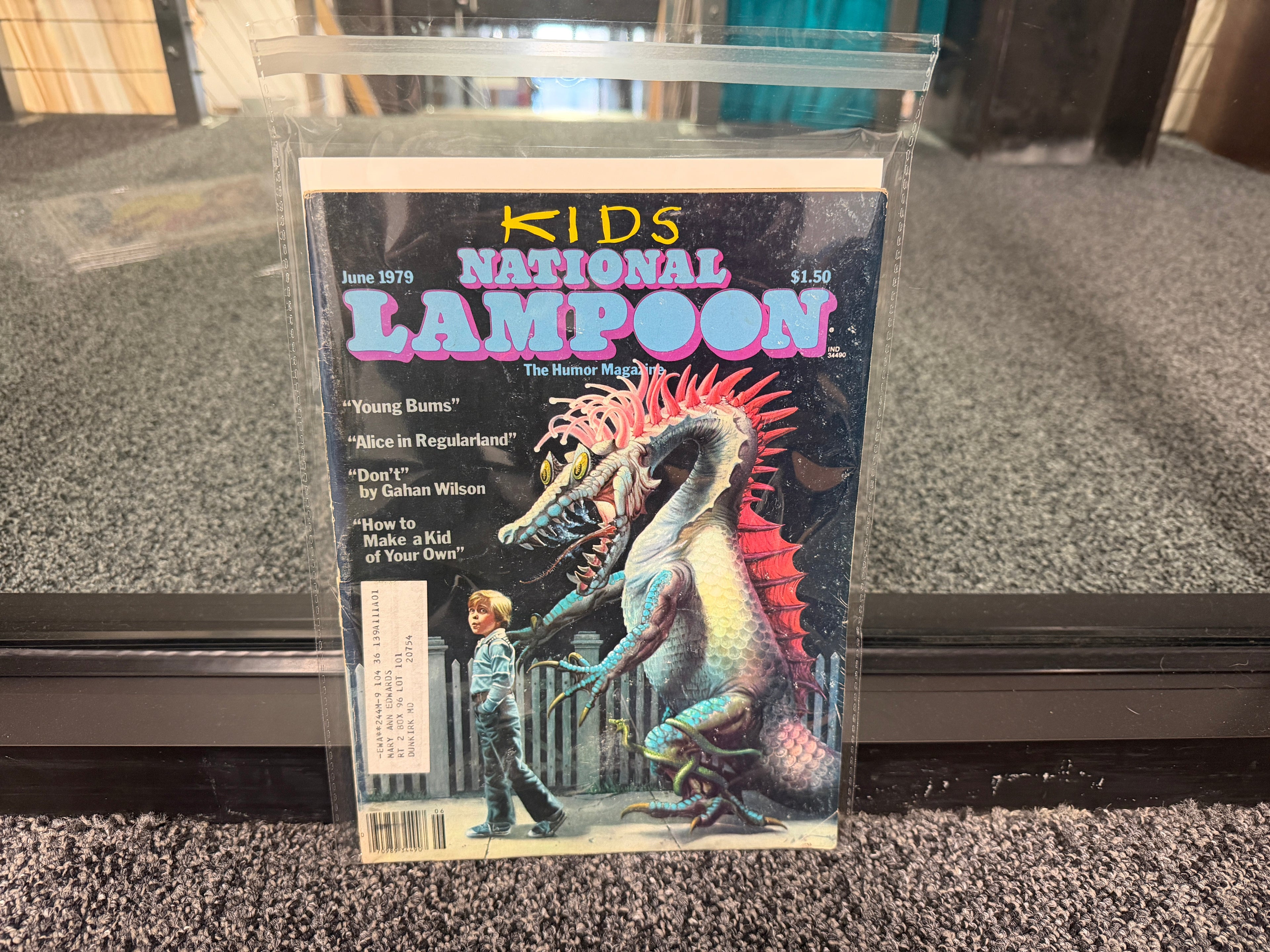 National Lampoon June 1979 Kids Issue cover with boy walking alien creature on leash