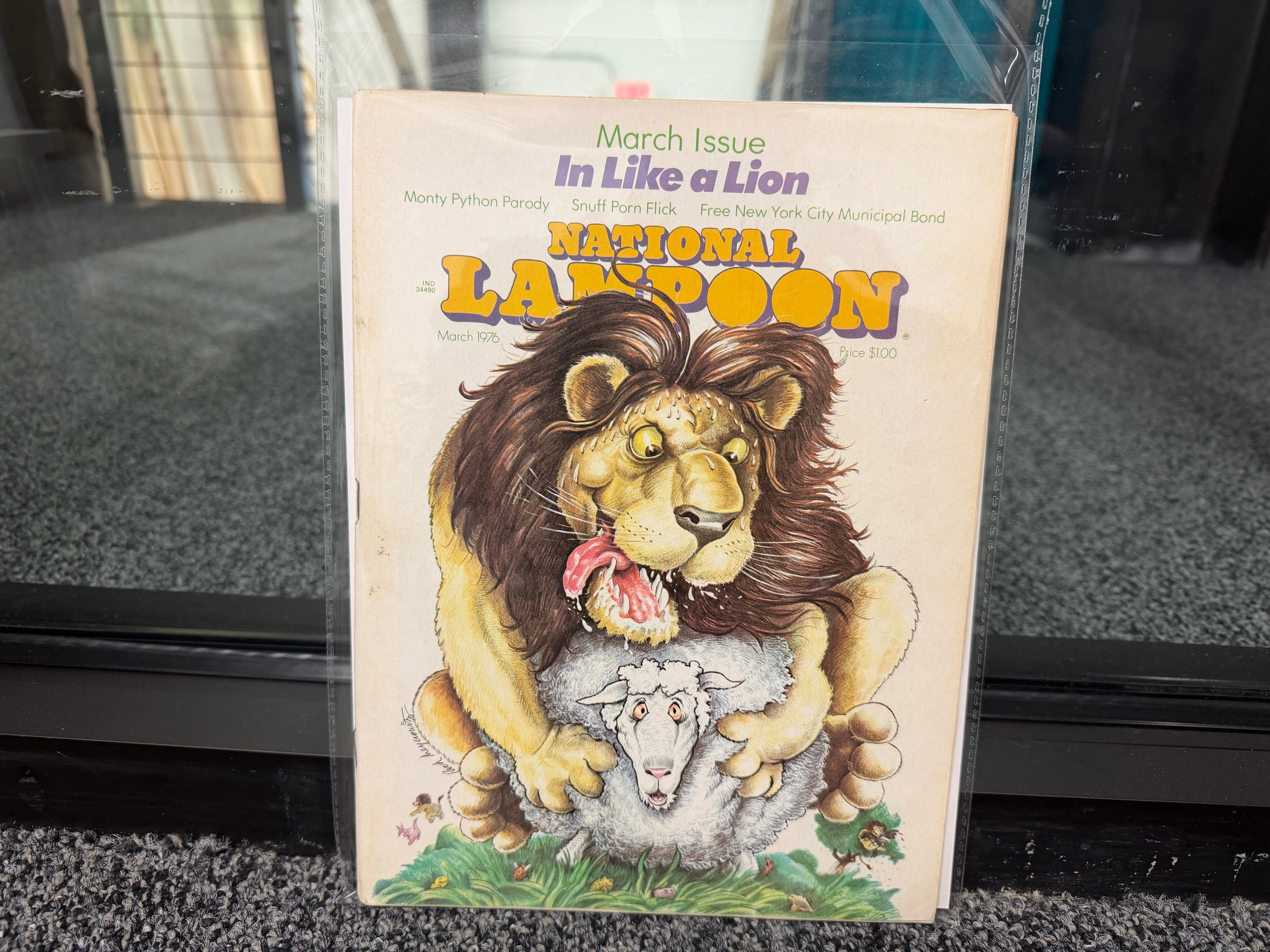 National Lampoon March 1976 In Like a Lion cover with cartoon lion sitting on lamb