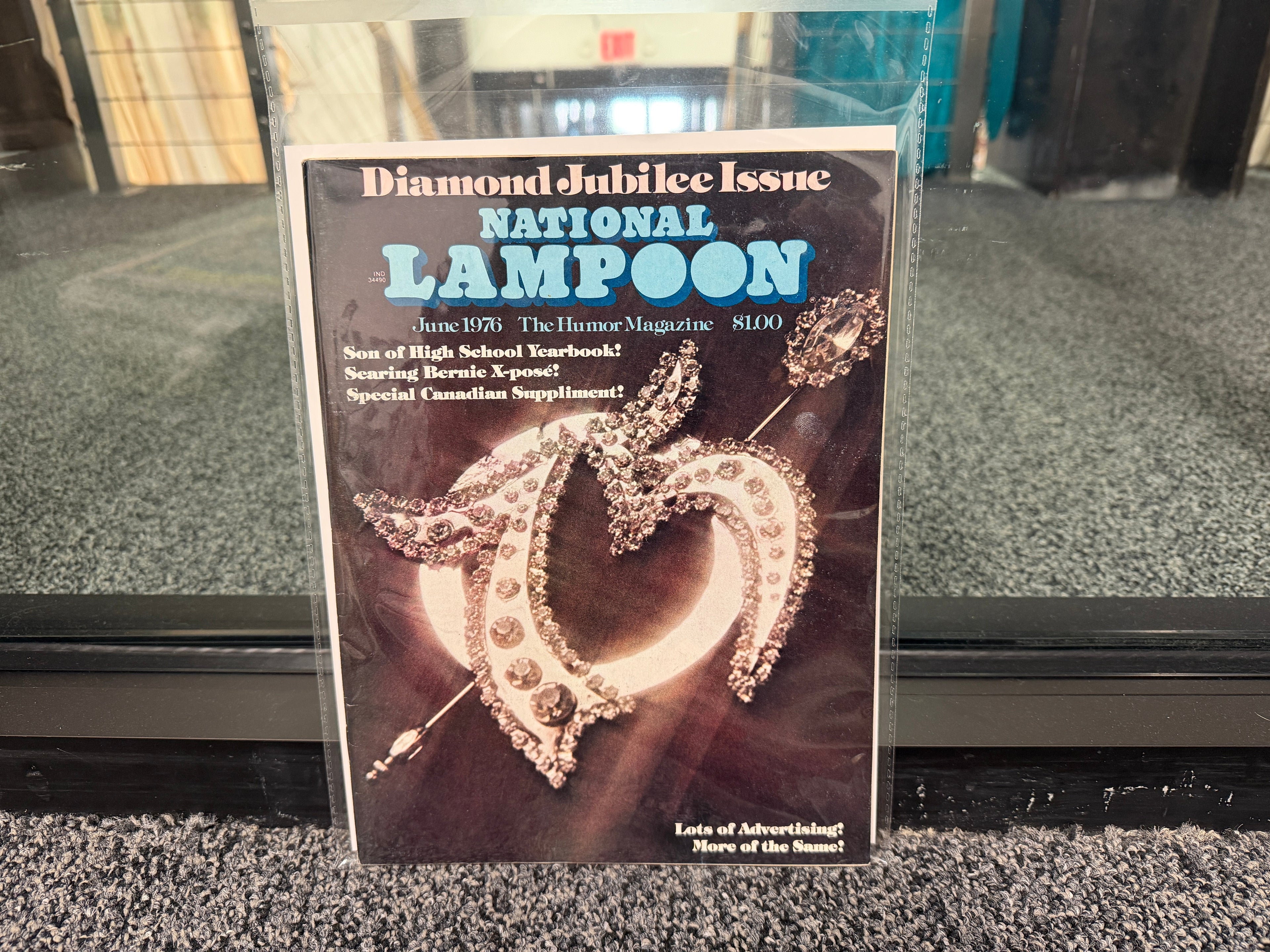 National Lampoon June 1976 Diamond Jubilee Issue cover with rhinestone heart brooch