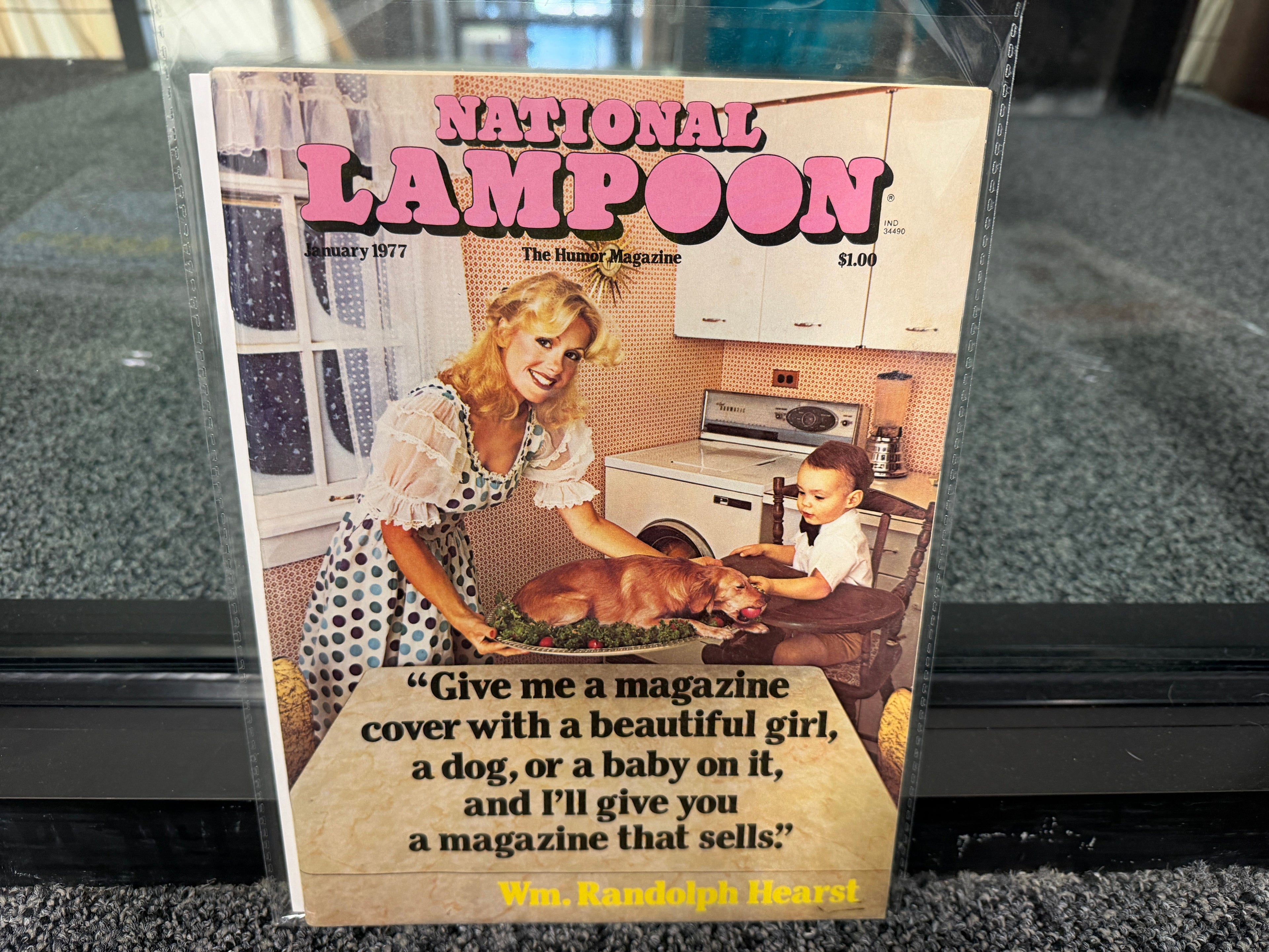 National Lampoon January 1977 Hearst Issue cover with woman presenting roasted dog to toddler