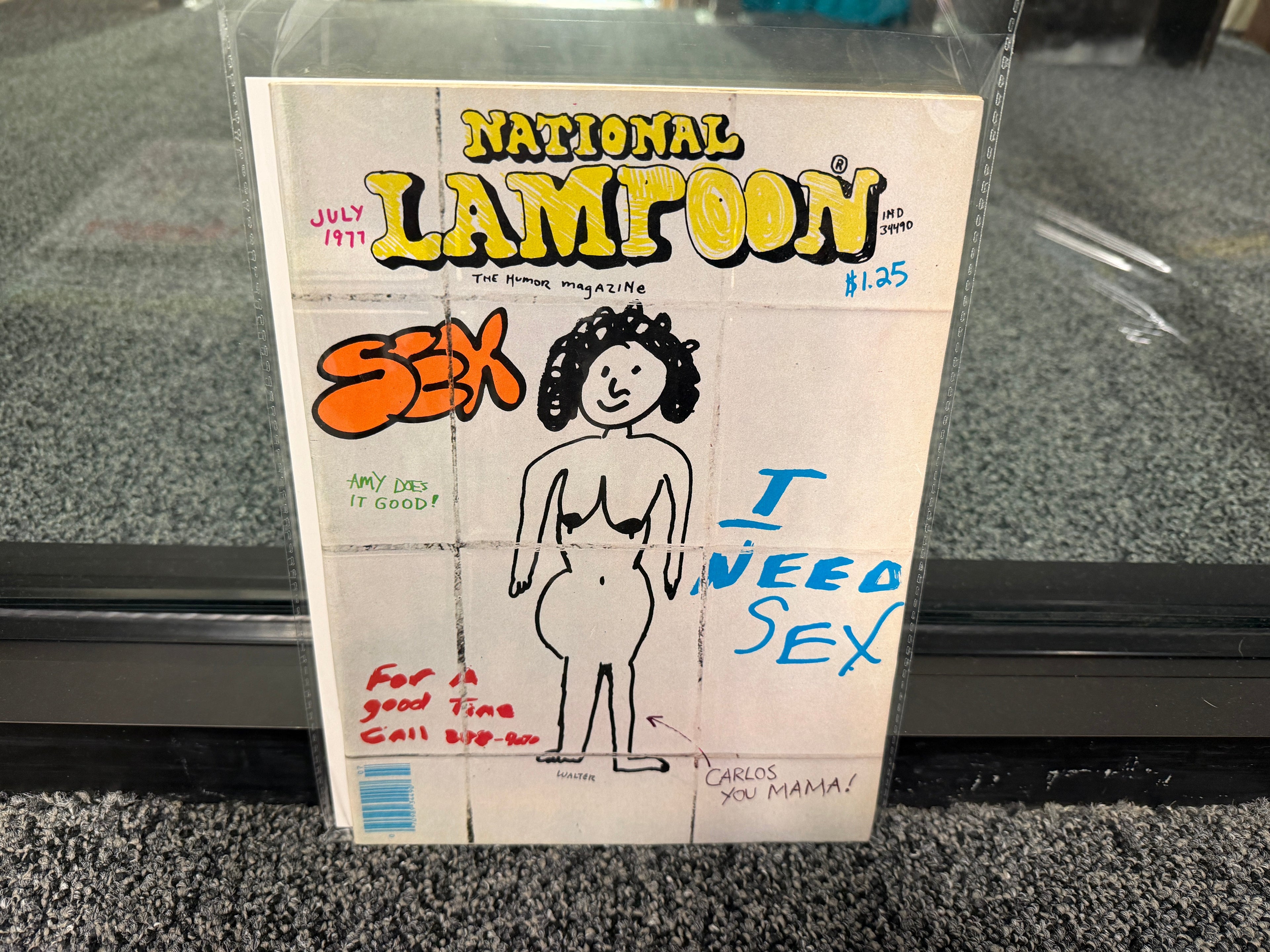 National Lampoon July 1977 Sex Issue cover with bathroom wall graffiti signed by Walter Minus