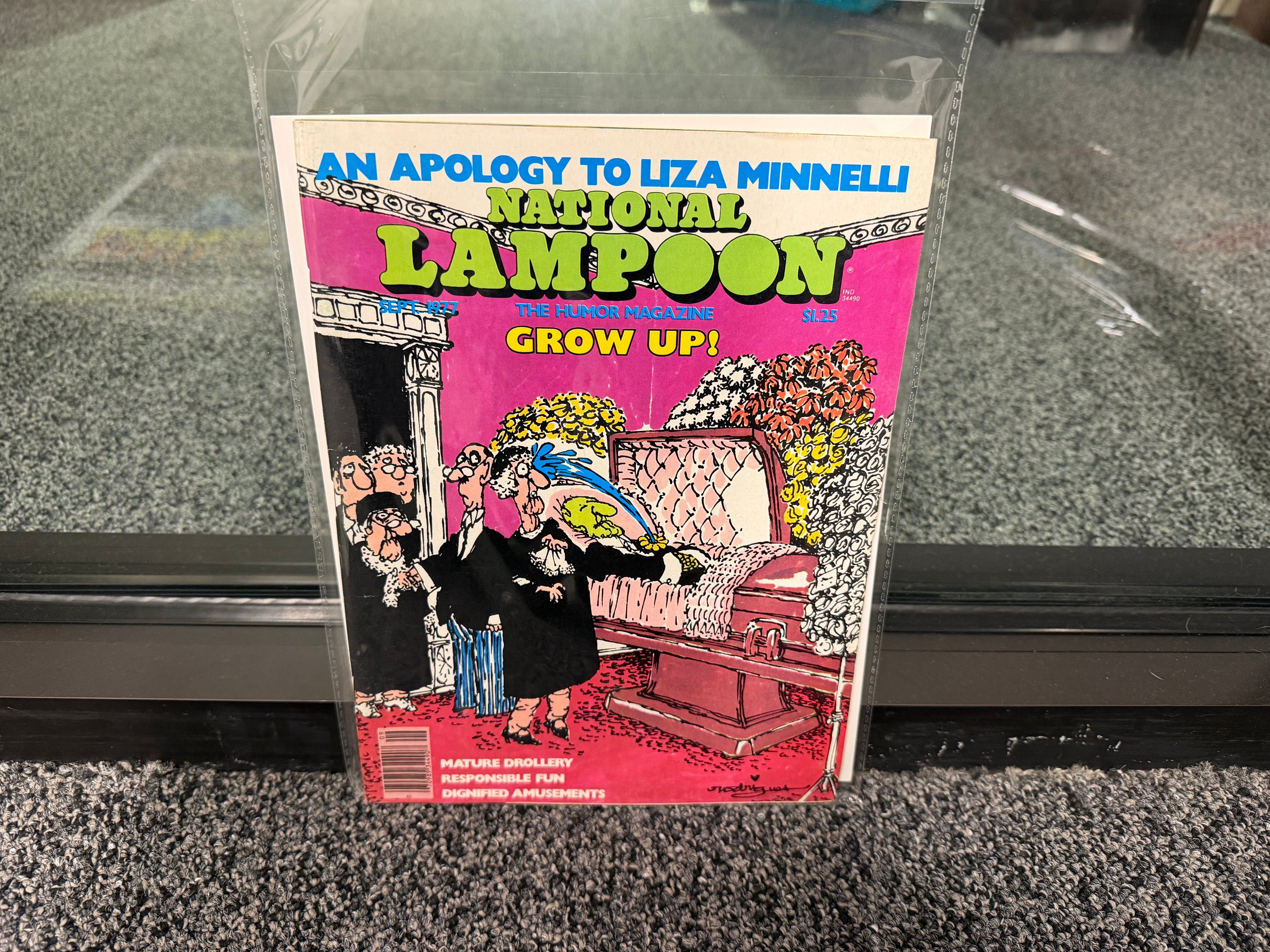 National Lampoon September 1977 Grow Up issue cover with Rodrigues funeral mourners on pink background