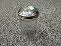 Vintage glass sugar shaker with metal flip-top lid
