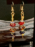 Handmade copper crystal earrings by Sweet Sinister — red and purple bead drops with gold wire coil wrapping