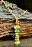 Handmade green wire wrap copper necklace by Sweet Sinister — stacked green faceted beads with copper wire on gold chain