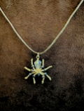 Handmade spider pendant necklace by Sweet Sinister — iridescent green and silver wire spider on silver chain
