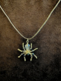 Handmade spider pendant necklace by Sweet Sinister — iridescent green and silver wire spider on silver chain