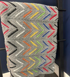 Handmade chevron crochet throw by Sweet Sinister — grey ripple pattern with multicolor accent stripes