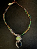 Handmade green turquoise and pearl necklace by Sweet Sinister — twisted multi-strand with large dark amethyst pendant drop